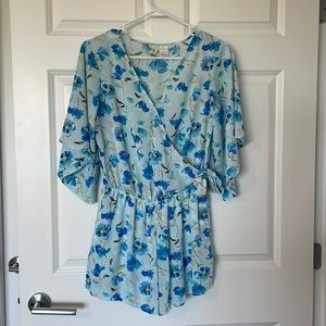 Mimi Chica women’s blue floral romper with pockets